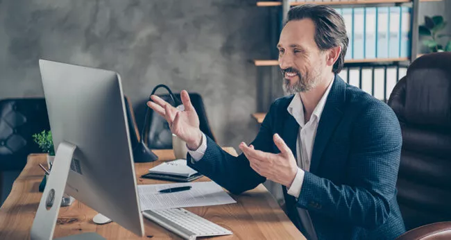 Profile side view portrait of his he nice handsome cheerful cheery man specialist attending web meeting discussing company development plan at modern concrete industrial work place station