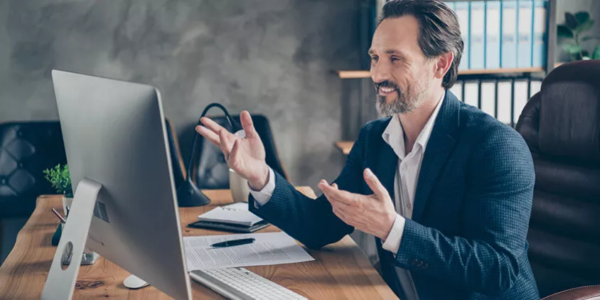 Profile side view portrait of his he nice handsome cheerful cheery man specialist attending web meeting discussing company development plan at modern concrete industrial work place station